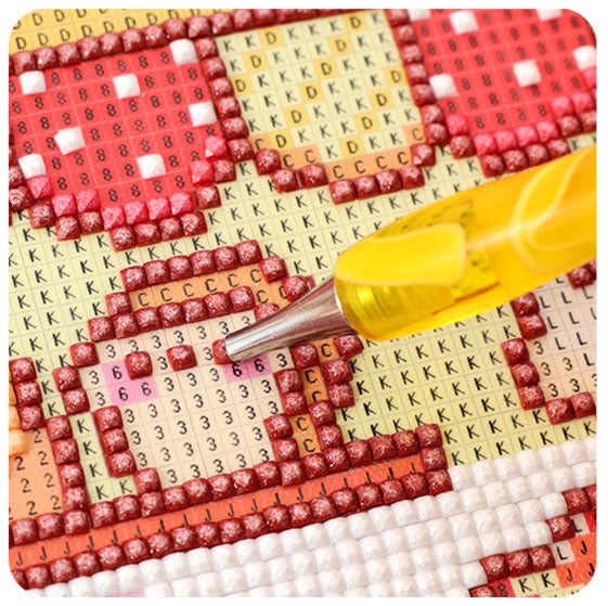 Step 4 of how to do diamond painting: placing the diamond drill onto the matching canvas symbol to build the artwork.